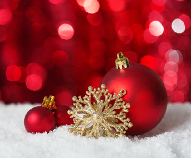 istock Christmas Baubles on red background with sparkles . 1022109722
