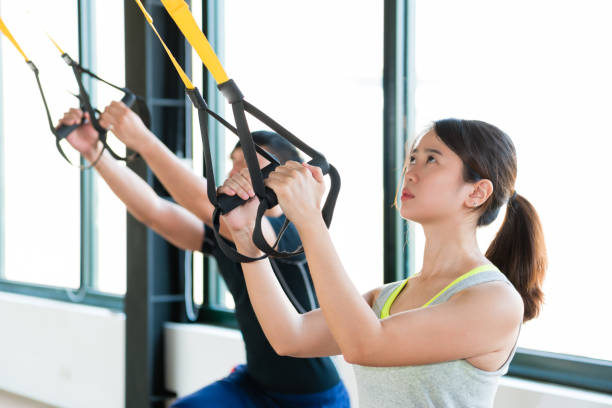 istock charming Asian girl learning hard workout 1022113098