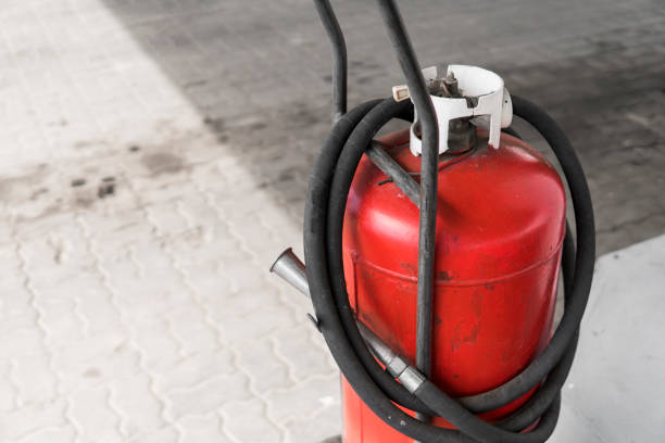 istock Red gas bottle cylinder with black tube. 1022118514