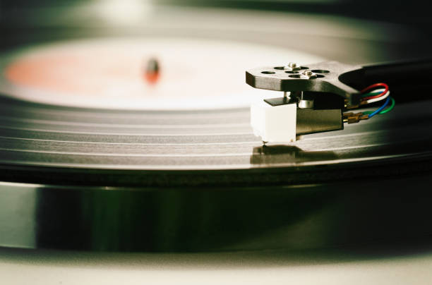 istock Long-playing record spinning on retro-style record player 1022118956