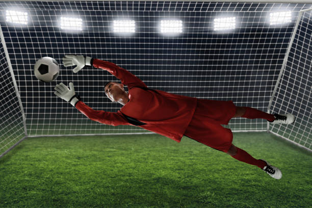 istock Soccer goalkeeper catches the ball 1022121166