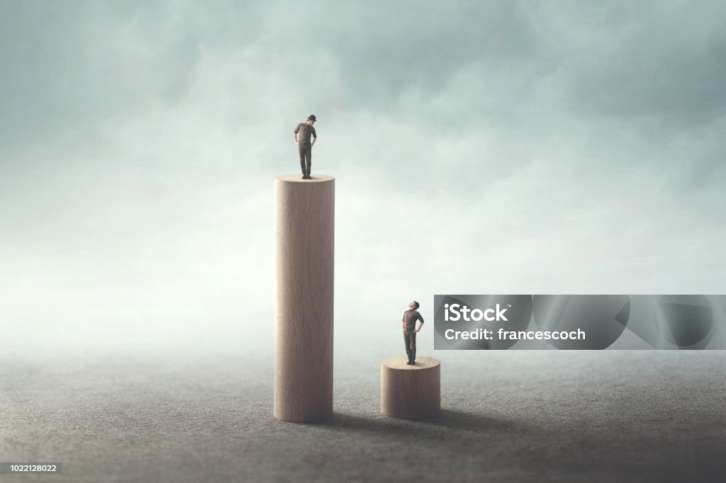 gap inequality concept equality concept between two men Imbalance Stock Photo