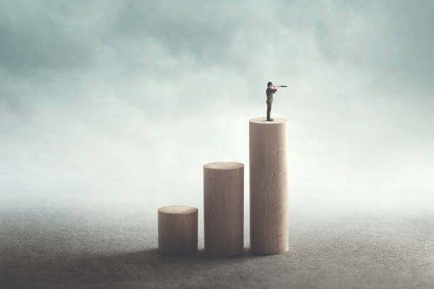 istock man on the top with binoculars observing the future 1022130186