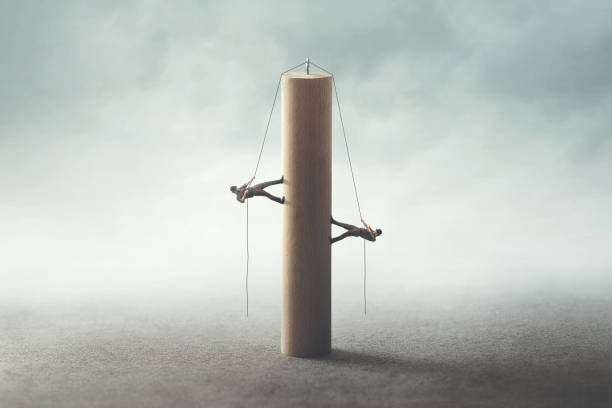 istock teamwork, people helping eachother to reach the same goal 1022130228
