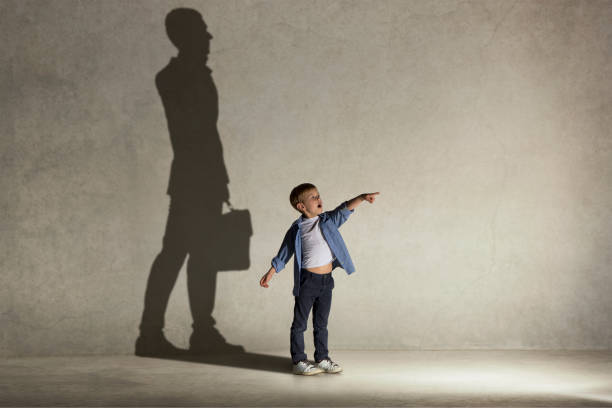 The little boy dreaming about businessman profession