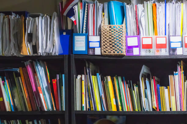 istock Old books and documents on shelf in working room, Backgrounds 1022130562