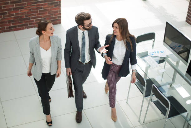 istock top view.three employees standing in the office 1022130640