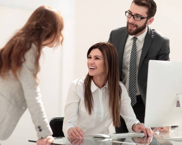 istock smiling business colleagues in the workplace 1022133946