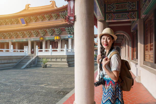 istock Asian woman tourist having fun walking 1022134746