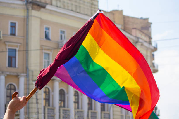 istock Rainbow flag umbrella at pride parade. Lgbt 1022138014