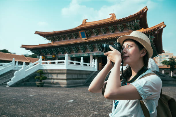 istock Young backpacker woman taking photo 1022138310