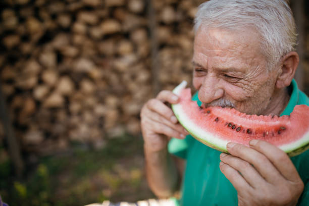 istock Senior man eating watermelon 1022138586