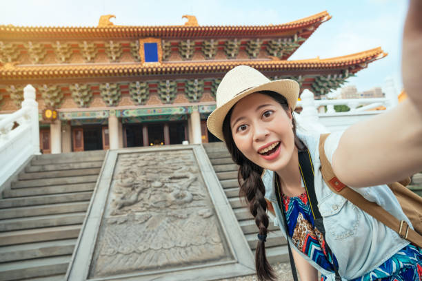 istock Happy Asian tourist taking a fun selfie 1022138646