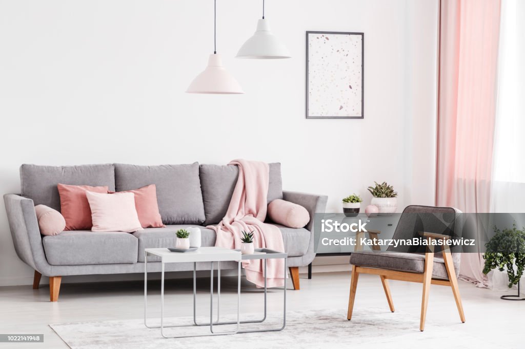 Frivillig kompas civilisere Retro Armchair Grey Sofa With Pink Pillows And Coffee Tables In An Elegant  Living Room Interior Real Photo Stock Photo - Download Image Now - iStock