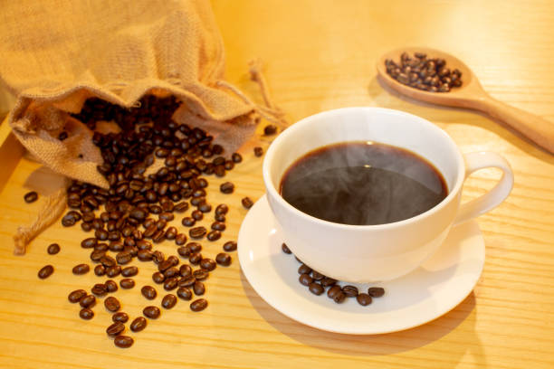 istock Coffee cup on the table near have coffee bean. 1022147956