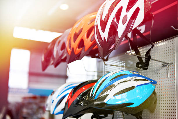 istock Modern protective sport helmets for cyclists in store 1022154386