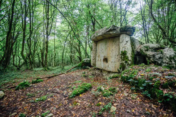 Ancient mysterious megalithic construction dolmen in Abkhazian forest, Azanta, Abkhazia