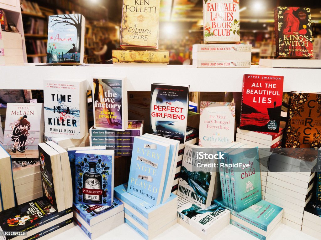 Display of contemporary fiction books in store window A group of modern fiction books is on display in a book store window. Bookstore Stock Photo