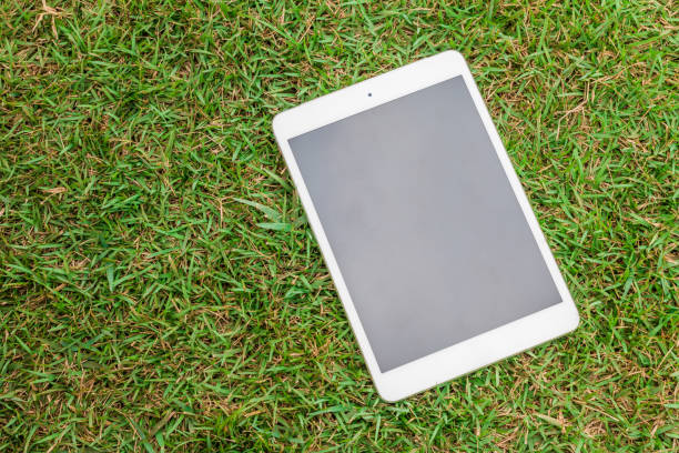 istock tablet 8.4 inches on green glass 1022160122
