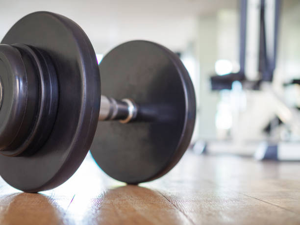 istock Dumbbell on gym floor 1022162638