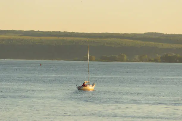 small Sailing boat in a warm sunset light