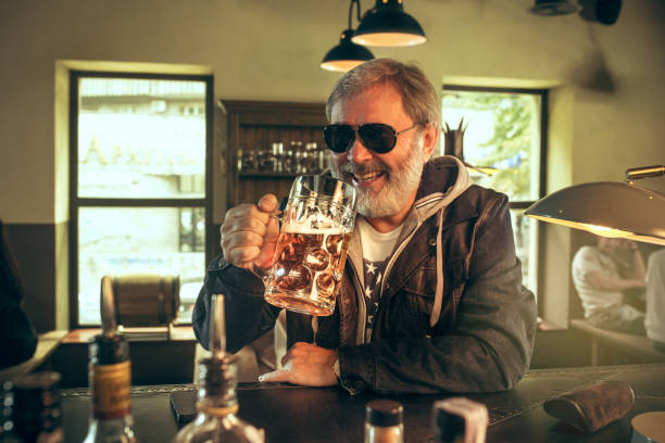 istock The senior bearded male drinking beer in pub 1022167240