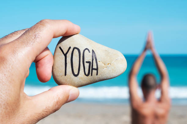 istock yogi man and text yoga in a stone 1022167782