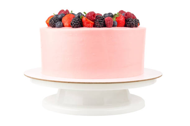 istock Cake with whipped pink cream, fresh strawberries, blueberries, blackberry and raspberry. 1022173122