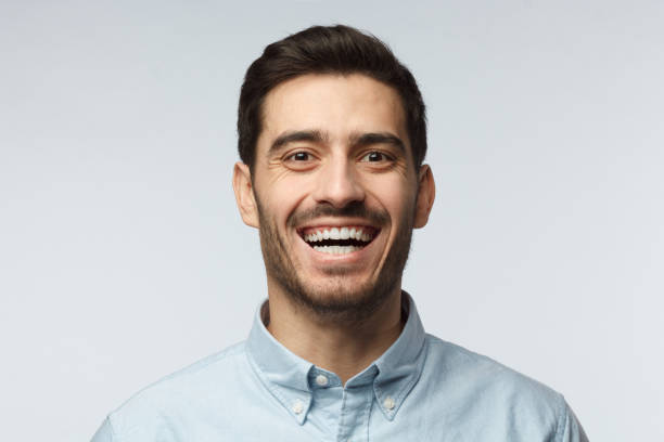 istock Joyful modern optimistic business man smiles broadly, shows white perfect teeth. Positive emotions, facial expressions and happiness concept. 1022174390