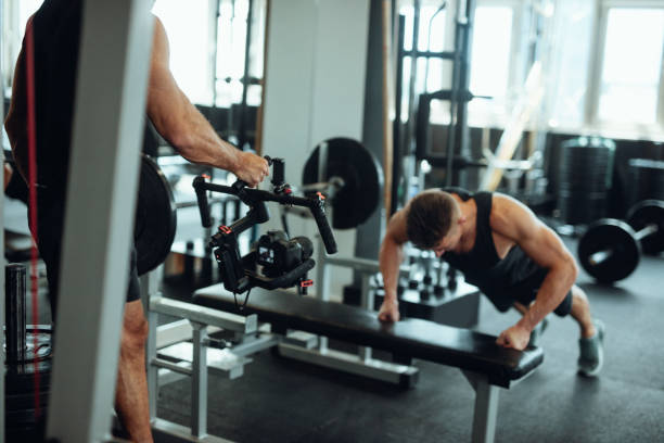 istock Personal trainer filming work out for social media 1022175294