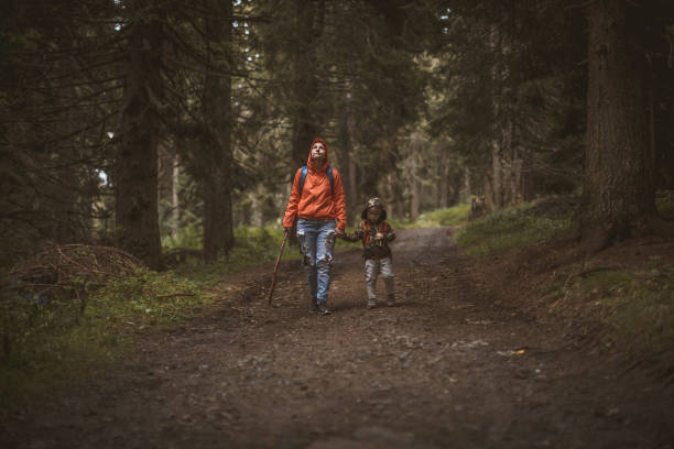 istock Mother and son hiking in forest 1022182620