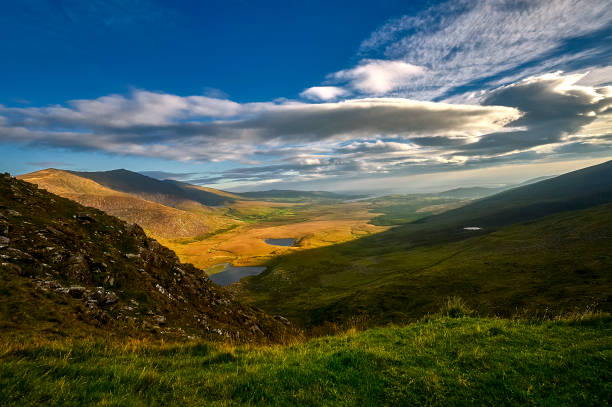 istock sunny green mountain landscape on Dingle peninsula, Ireland 1022187894