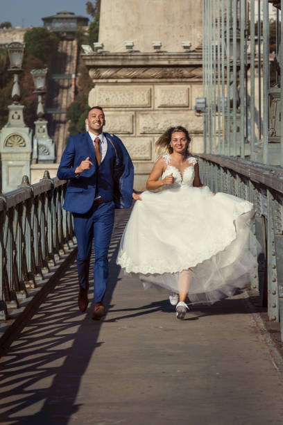 istock young happy romantic wedding couple outdoors in city 1022197812