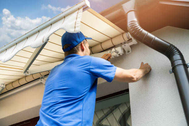 man installing awning on house facade wall over the balcony window man installing awning on house facade wall over the balcony window awning stock pictures, royalty-free photos & images