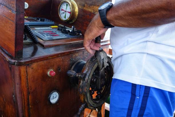 istock commander at the helm of a boat 1022203864