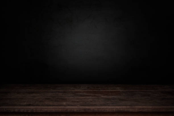 istock old wood table in front of dark and gray abstract  cement wall and studio room gradient background 1022213418