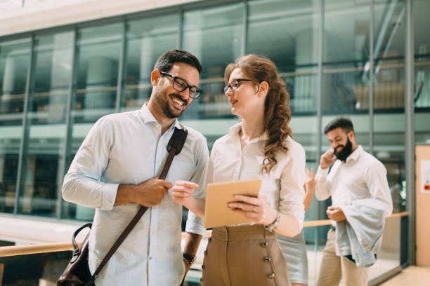 istock Happy business colleagues in modern office 1022216148