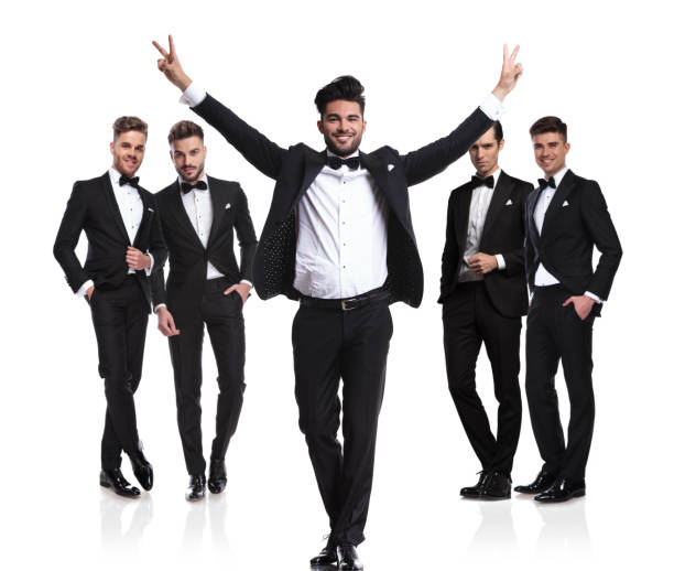 istock groom makes victory sign in front of his team 1022218814