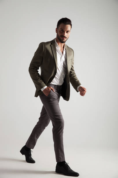 istock relaxed man in green suit steps to side 1022224948