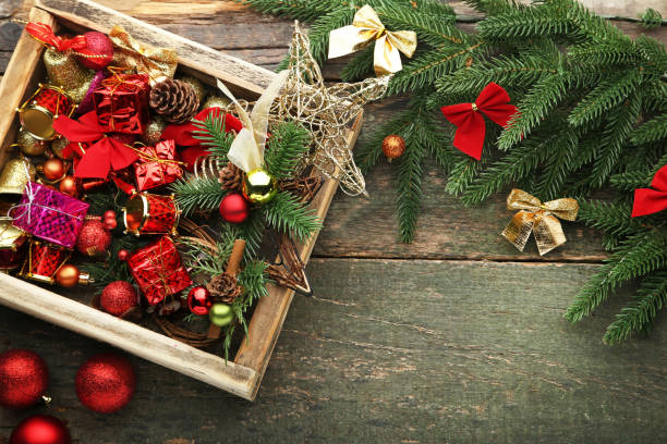 istock Colourful christmas decorations in crate with fir-tree branches 1022225364