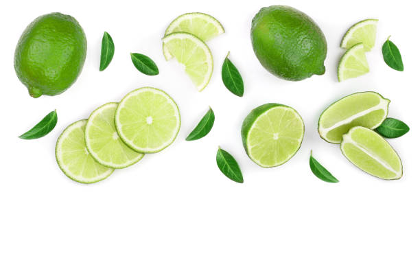 istock sliced lime vith leaves isolated on white background with copy space for your text. Top view. Flat lay pattern 1022227644