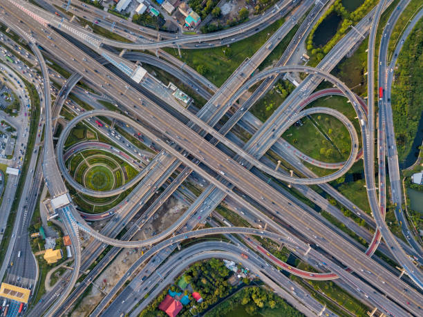istock Top view of Highway road junctions. The Intersecting freeway road overpass the eastern outer ring road of Bangkok, Thailand. 1022227912