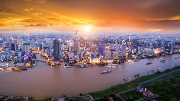 Aerial view of Ho Chi Minh City skyline and skyscrapers in center of heart business at Ho Chi Minh City downtown. Panorama of cityscape on Saigon river in Ho Chi Minh City at Vietnam at sunset scene Aerial view of Ho Chi Minh City skyline and skyscrapers in center of heart business at Ho Chi Minh City downtown. Panorama of cityscape on Saigon river in Ho Chi Minh City at Vietnam at sunset scene ho chi minh city photos stock pictures, royalty-free photos & images