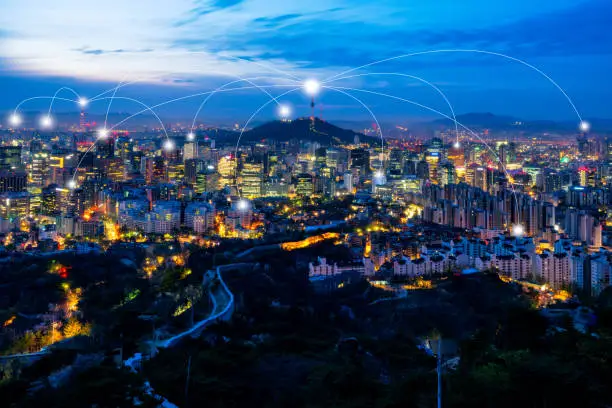 Seoul downtown city skyline with network connection concept, Aerial view of N Seoul Tower at Namsan Park in twilight sky in morning. The best viewpoint from inwangsan mountain in Seoul, South Korea