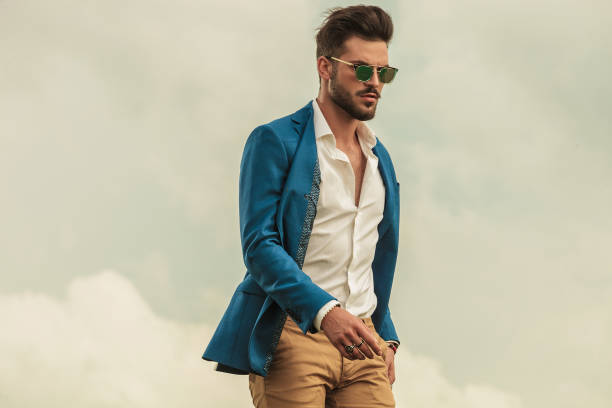 istock smart casual man with sunglasses on grey clouds background 1022229092