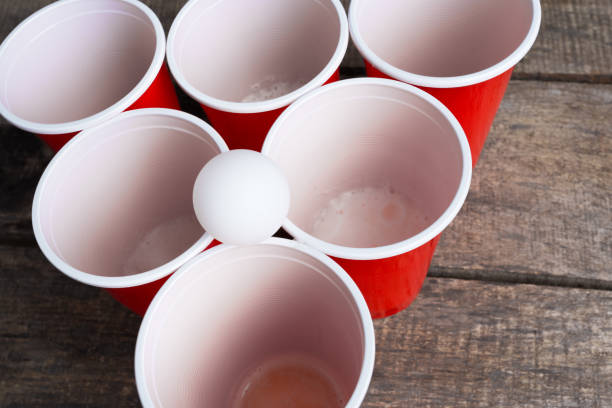 istock Game Beer Pong on wooden table 1022230316