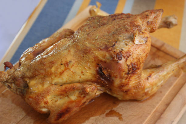 istock Roasted farm chicken stuffed with garlic 1022233660
