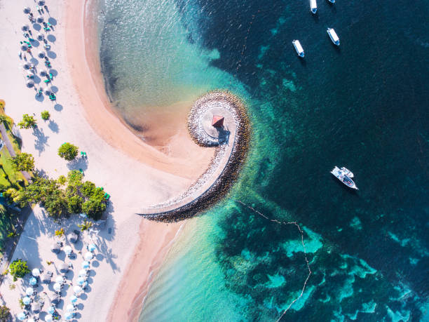 bali coast with a figurative breakwater aerial view - sanur imagens e fotografias de stock