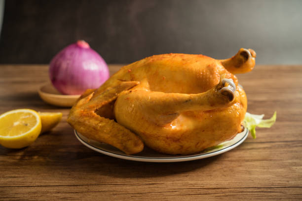 istock Roast chicken on the wooden table 1022242660