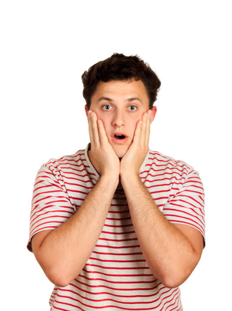 istock man does not believe his success, keeps hands on head, stares at camera, says omg or wow. emotional guy isolated on white background 1022242730